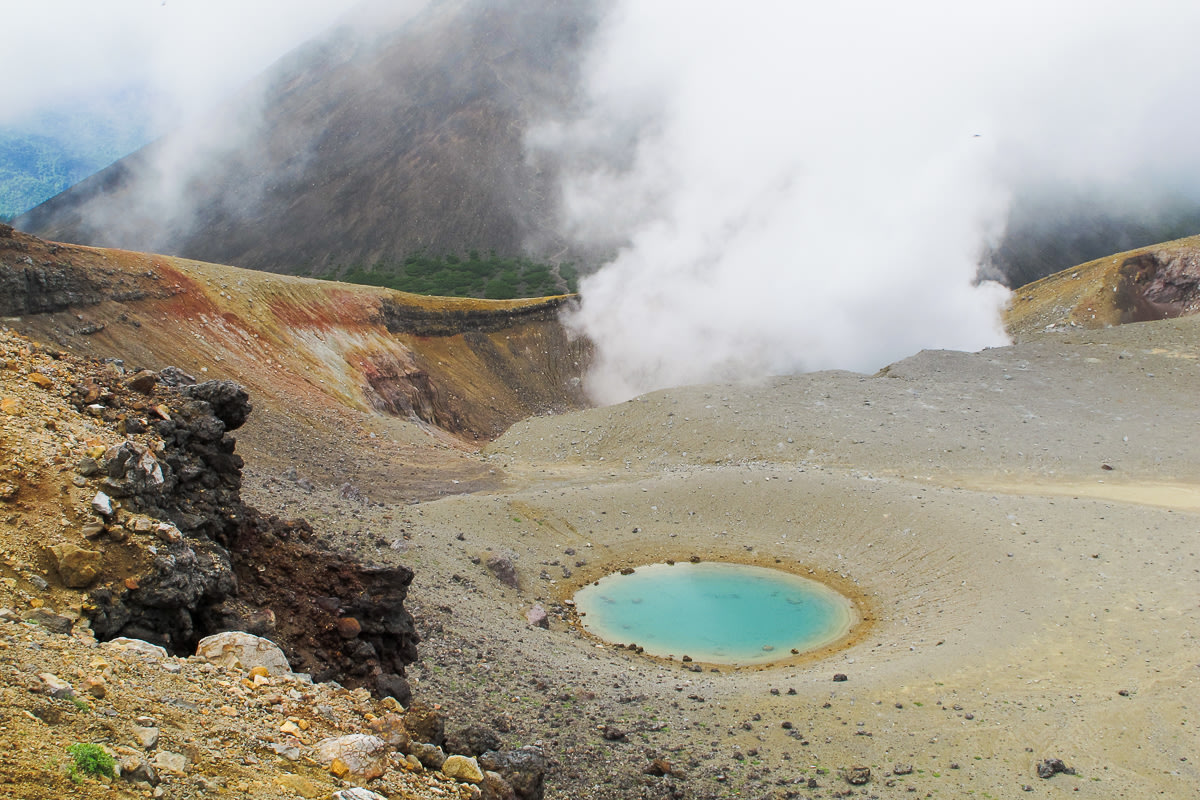 Views of the turquoise volcanic crater on the Mt Meakan hiking trail in Hokkaido