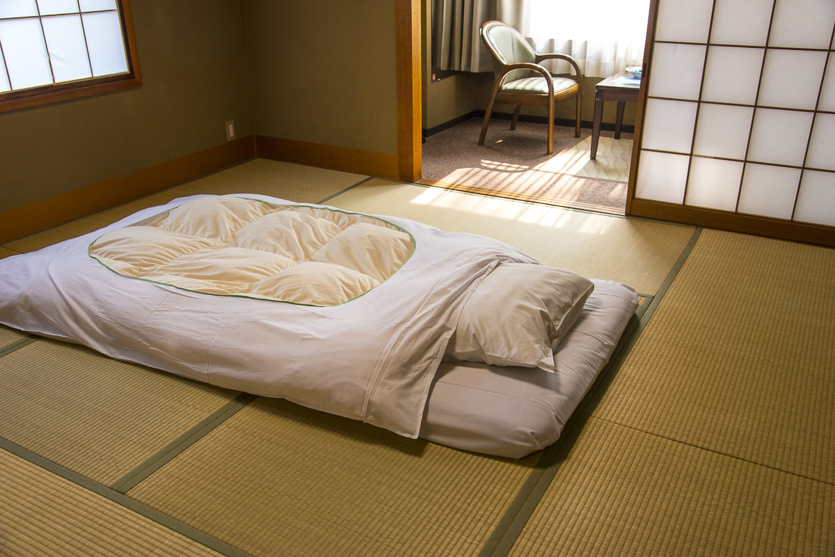 Japanese futon bedding on tatami floor