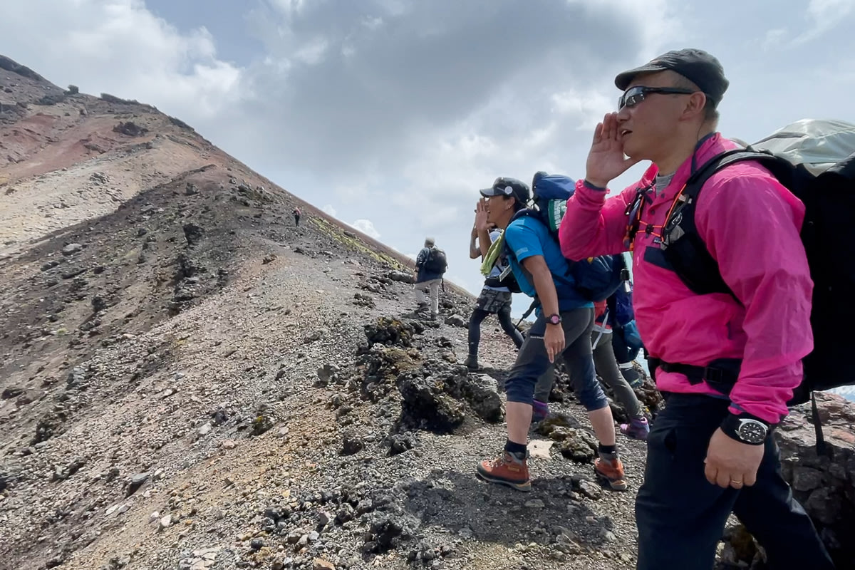 HIkers calling out into open space on Mt Asahidake, Daisetsuzan National Park.
