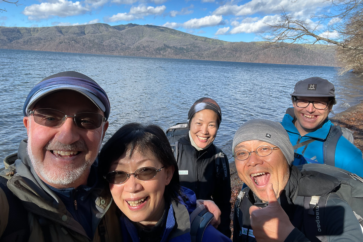 Group selfie with Lake Kussharo