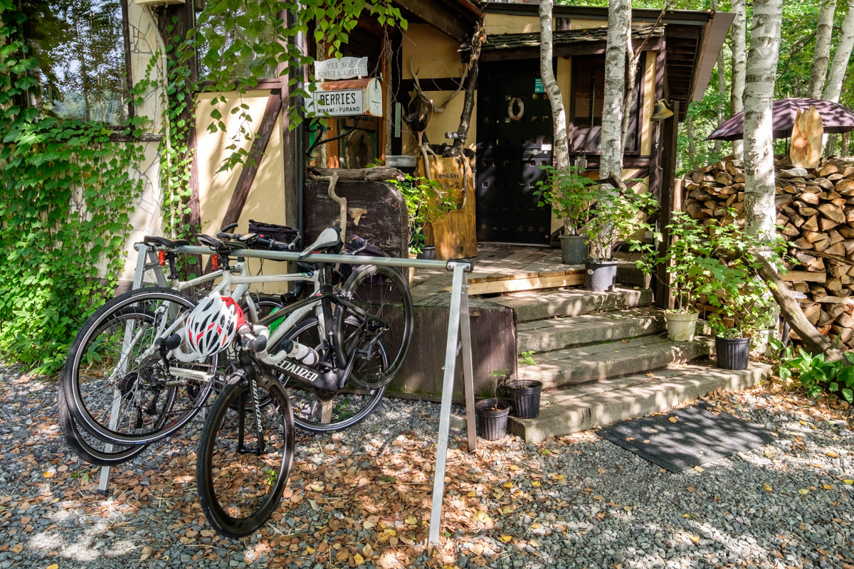 Bikes sit on a rack outside a rural cafe