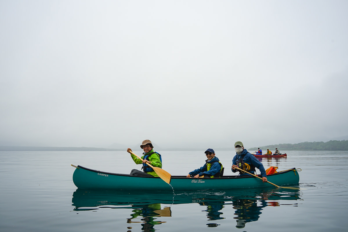 Canoeing on the still water of Lake Kussharo