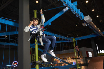 Kid on zip line in Gravity ropes