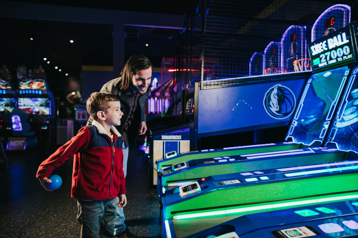 Dad & Son playing Skee Ball