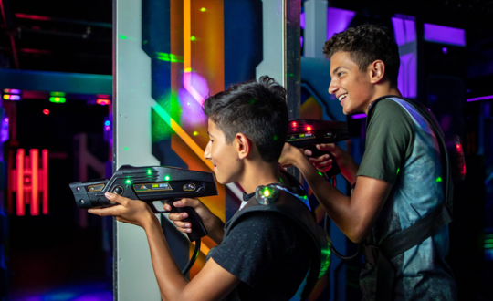 Boys playing laser tag at Main Event