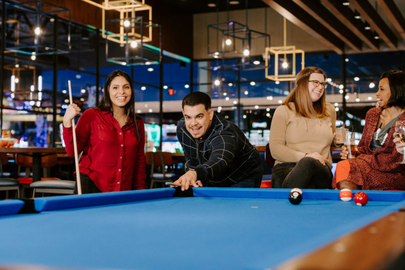 Friend Group playing Billiards