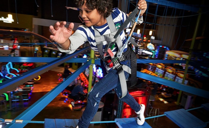 A Kid running through Gravity Ropes