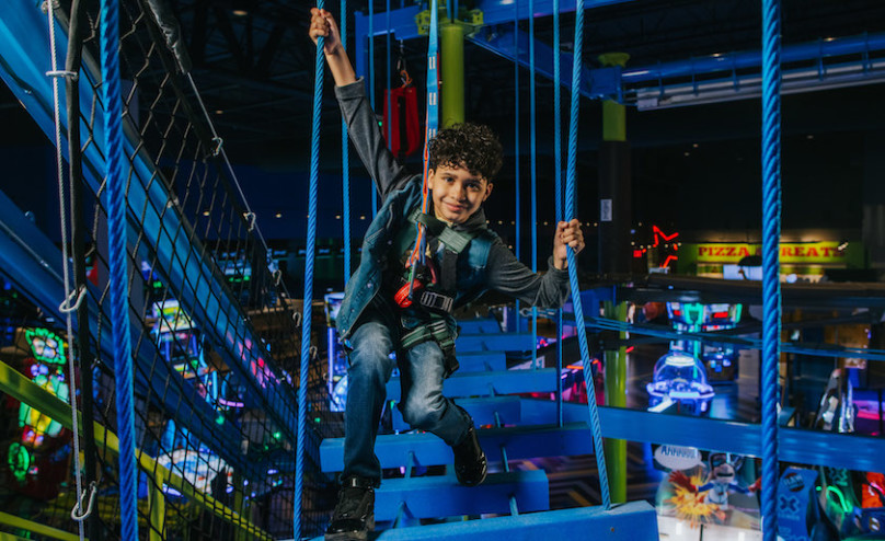 A Kid running through Gravity Ropes
