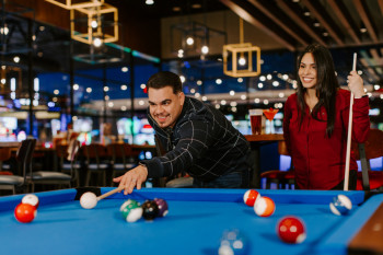 Couple playing Billiards