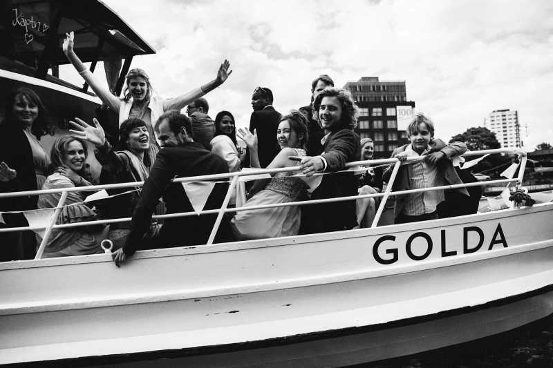 Wedding guests celebrating on the bow of the Golda ship in Berlin