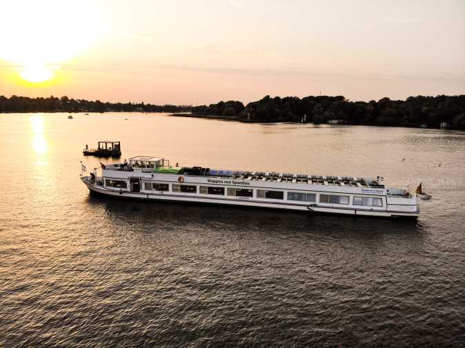 Party ship Wappen von Spandau at sunset on the Havel