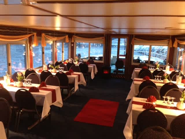 Salon with tables and chairs on the Europa ship