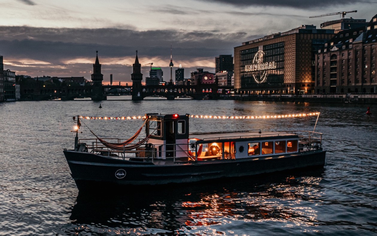 Party boat Liesel in Berlin in front of Oberbaum Bridge