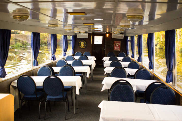 Salon with tables and chairs on the Saga ship