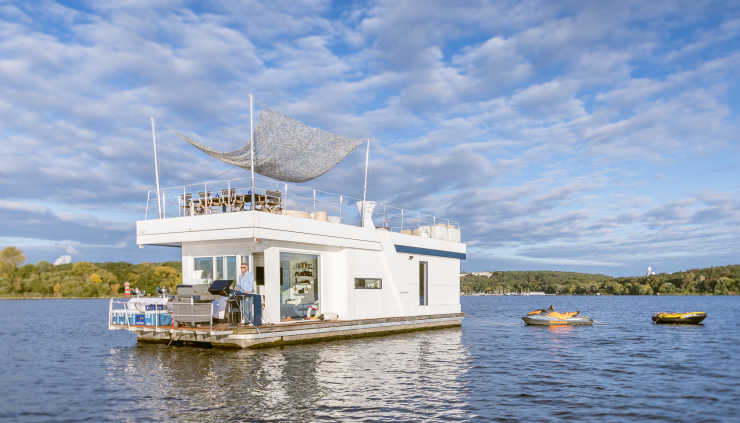 Luxury party boat H2Loft on the Havel with a jet ski in tow