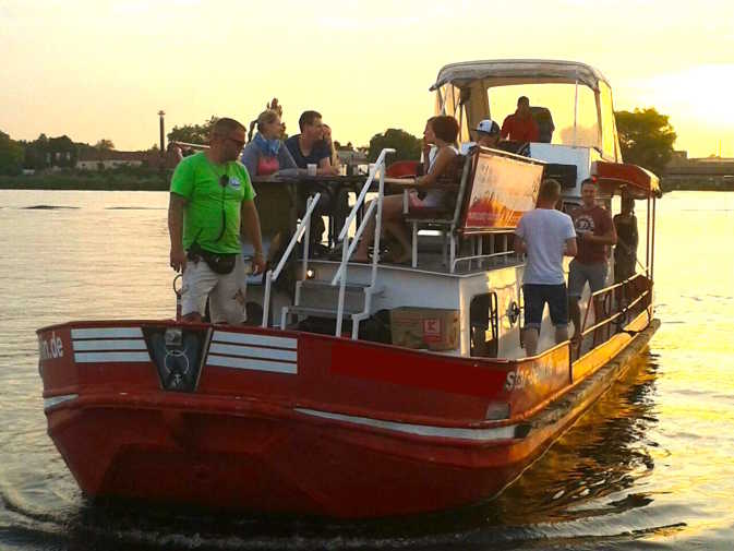Bachelor party on the Müggelsee at sunset with guests on board