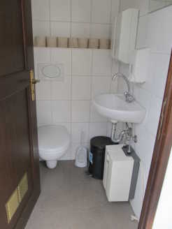Toilet with hand wash basin on the party ship Vera