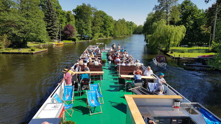 Sun deck with passengers on a boat tour on the ship Wappen von Spandau