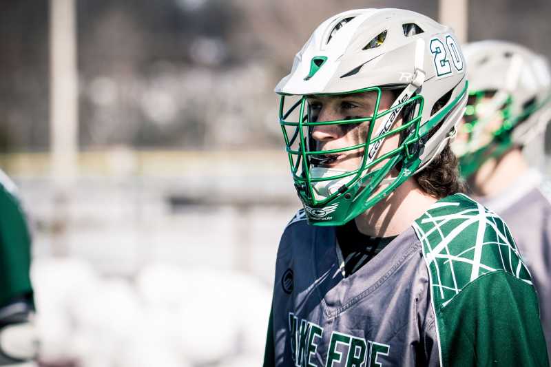 closeup image of a lake erie college lacrosse player wearing a helmet