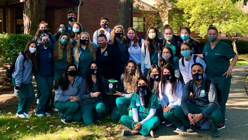 Group photo of PA students outside wearing masks