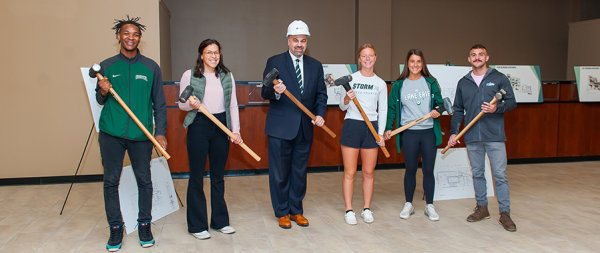 Lake Erie College students and president at the groundbreaking for new student housing on the square in Painesville.