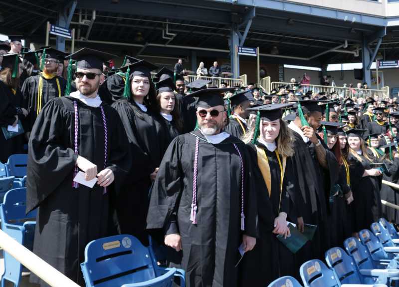 Students wait for their names to be called at commencement 