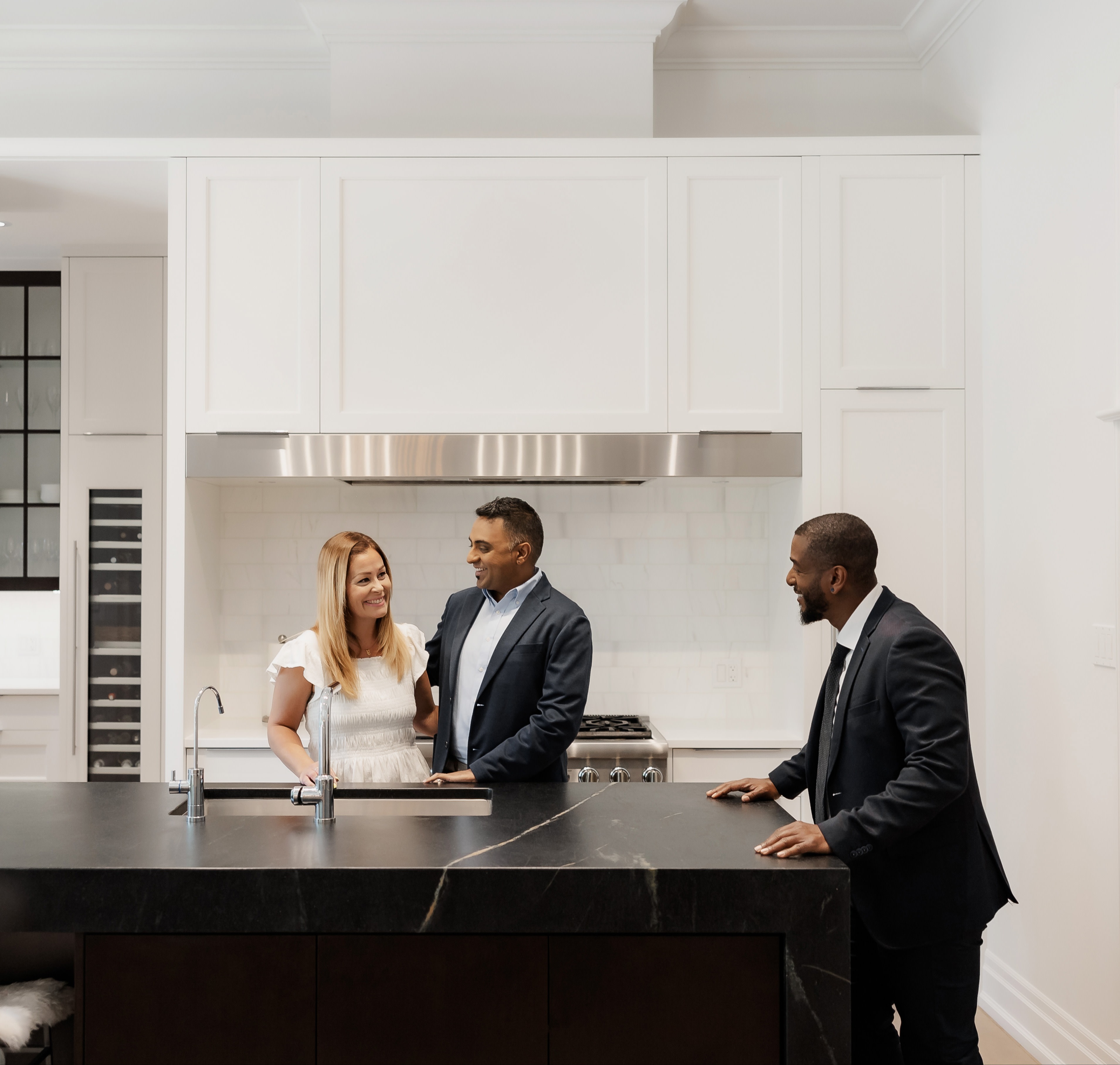 Advisor talking to couple in kitchen