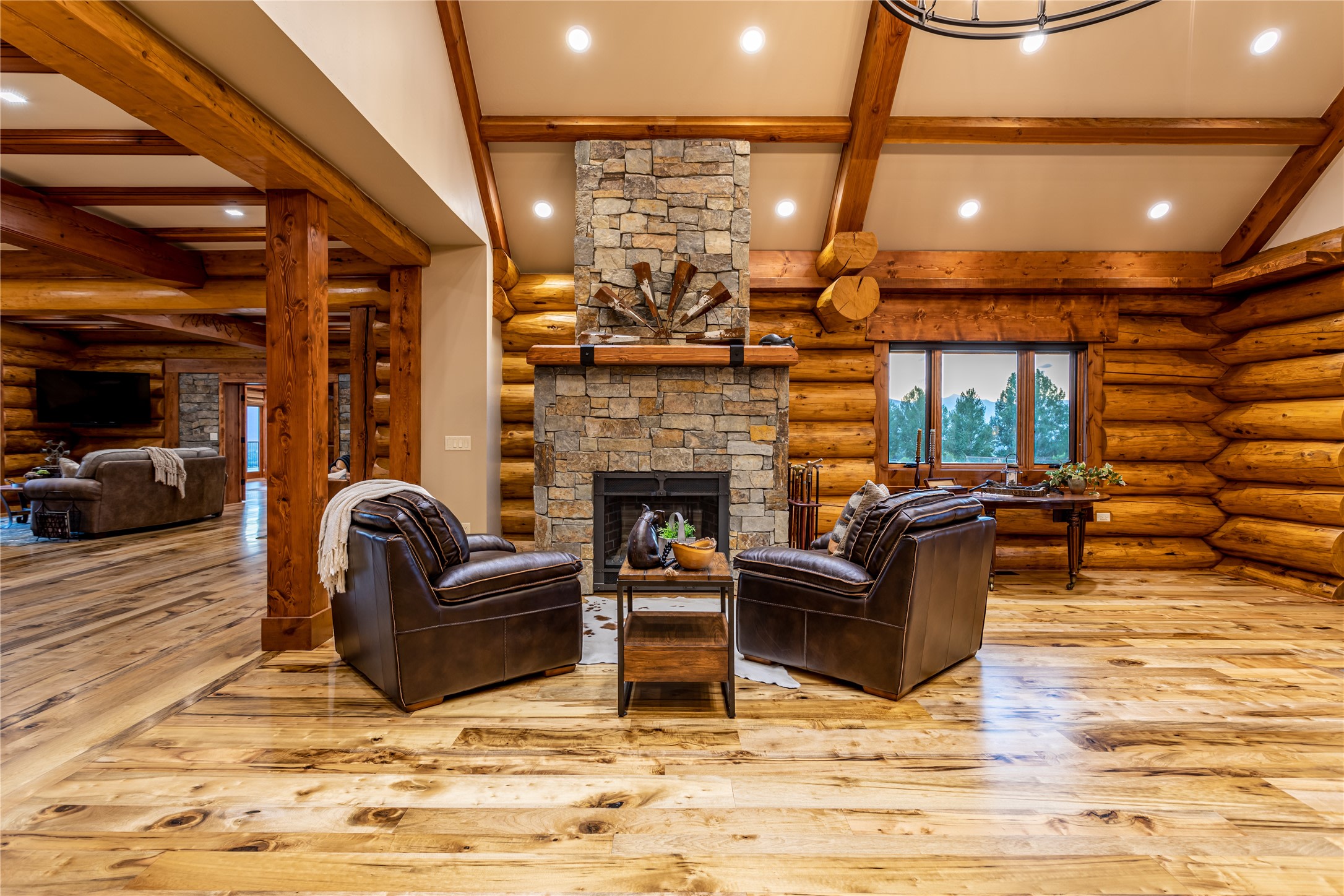 Room with wooden log walls.