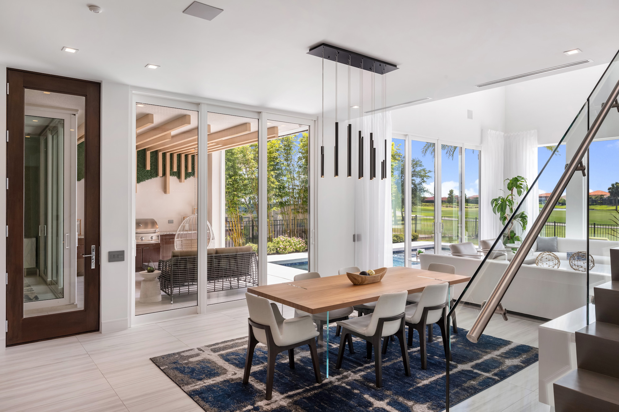 Bright open-concept interior with natural light and outdoor connection