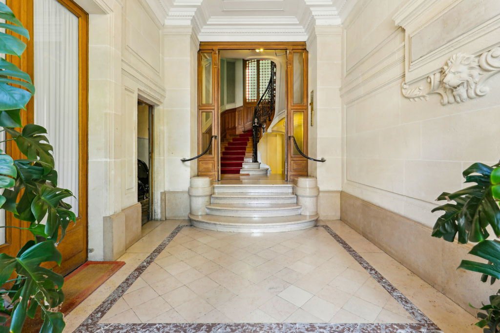 Marble entrance way with spiral staircase.