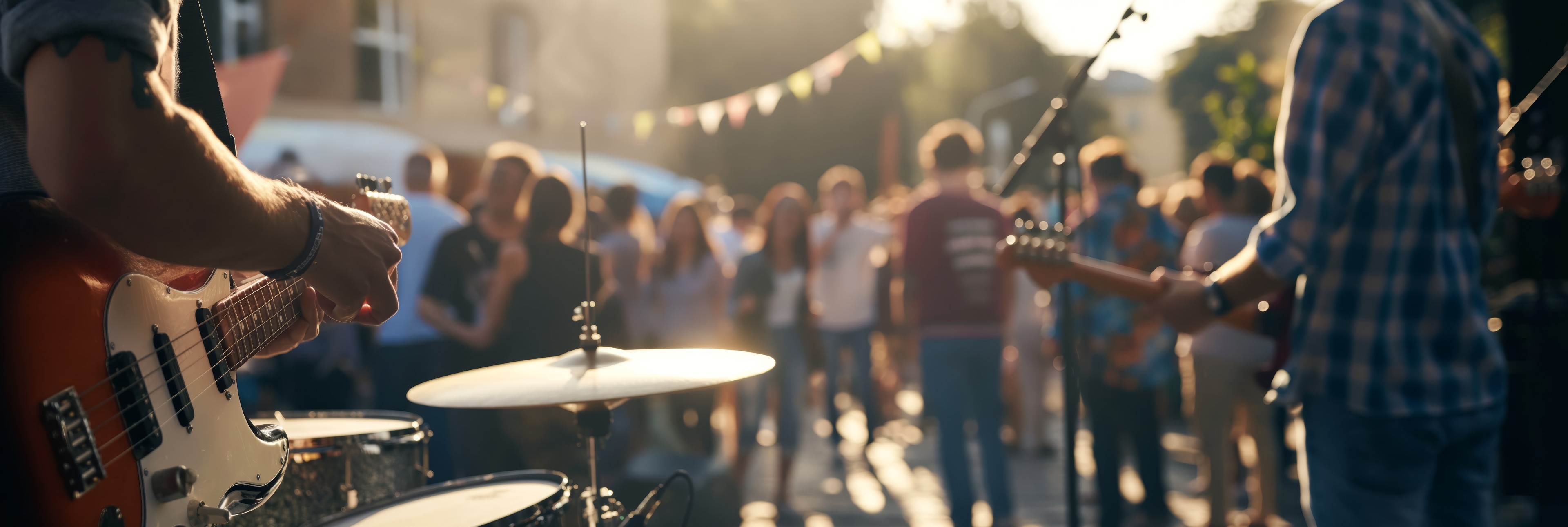 Band playing to crowd of people 