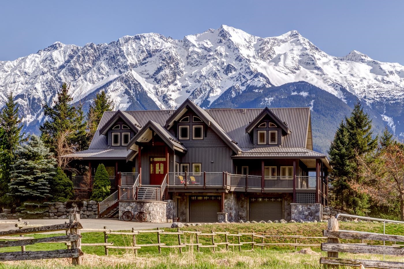 Luxury home with stunning mountain backdrop.