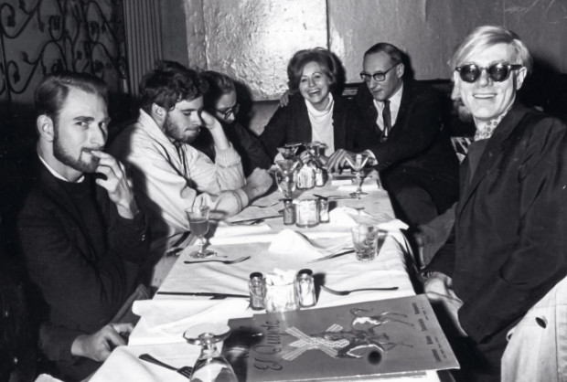 Hotel quests sitting around a dinner table 