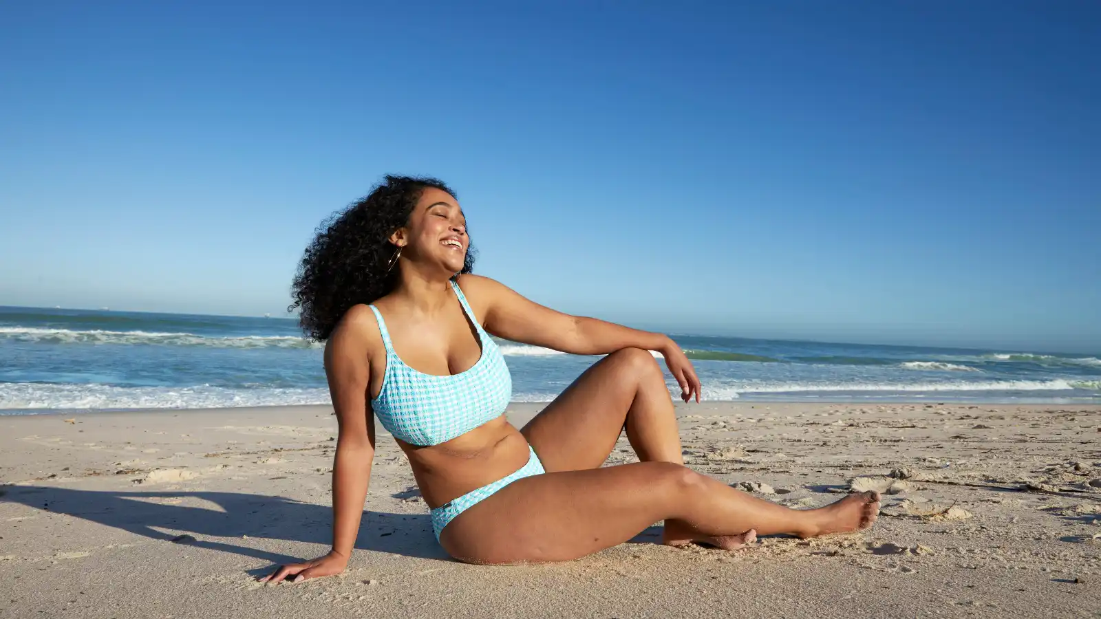 Woman sitting on the beach