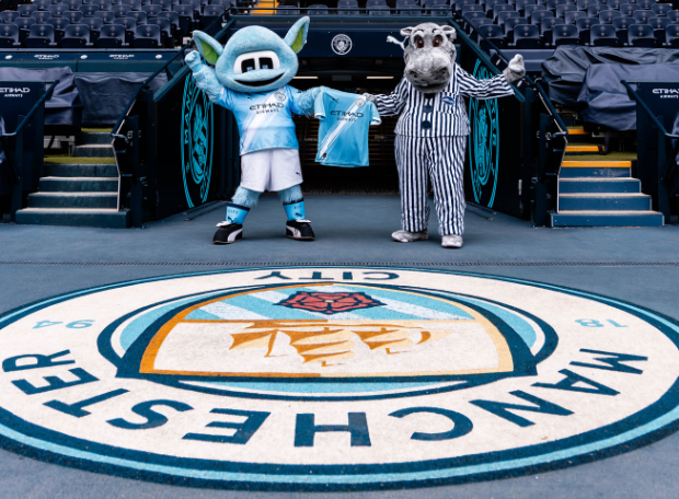 Manchester City's Moonchester and the Silentnight Hippo holding a Manchester City Shirt to symbolise the partnership.