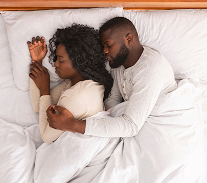 Couple sleeping cosily together