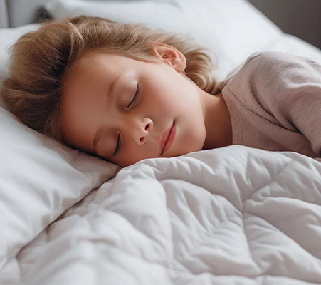 Child sleeping peacefully in bed