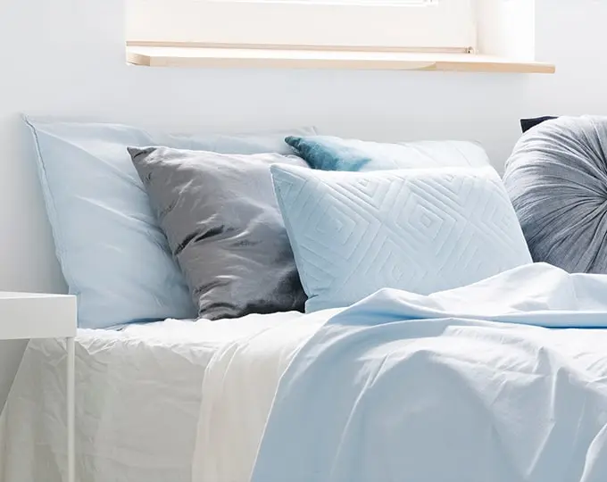 A bed with pastel blue colours - What colour should my bedroom be? 