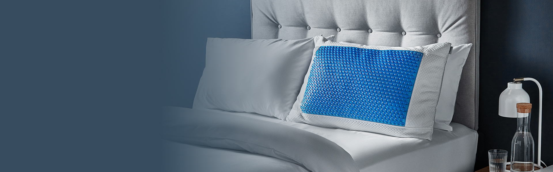 Cool gel pillow on bed with set of pillows