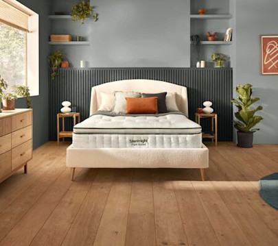 A mattress with a pillowtop in a botanic background.