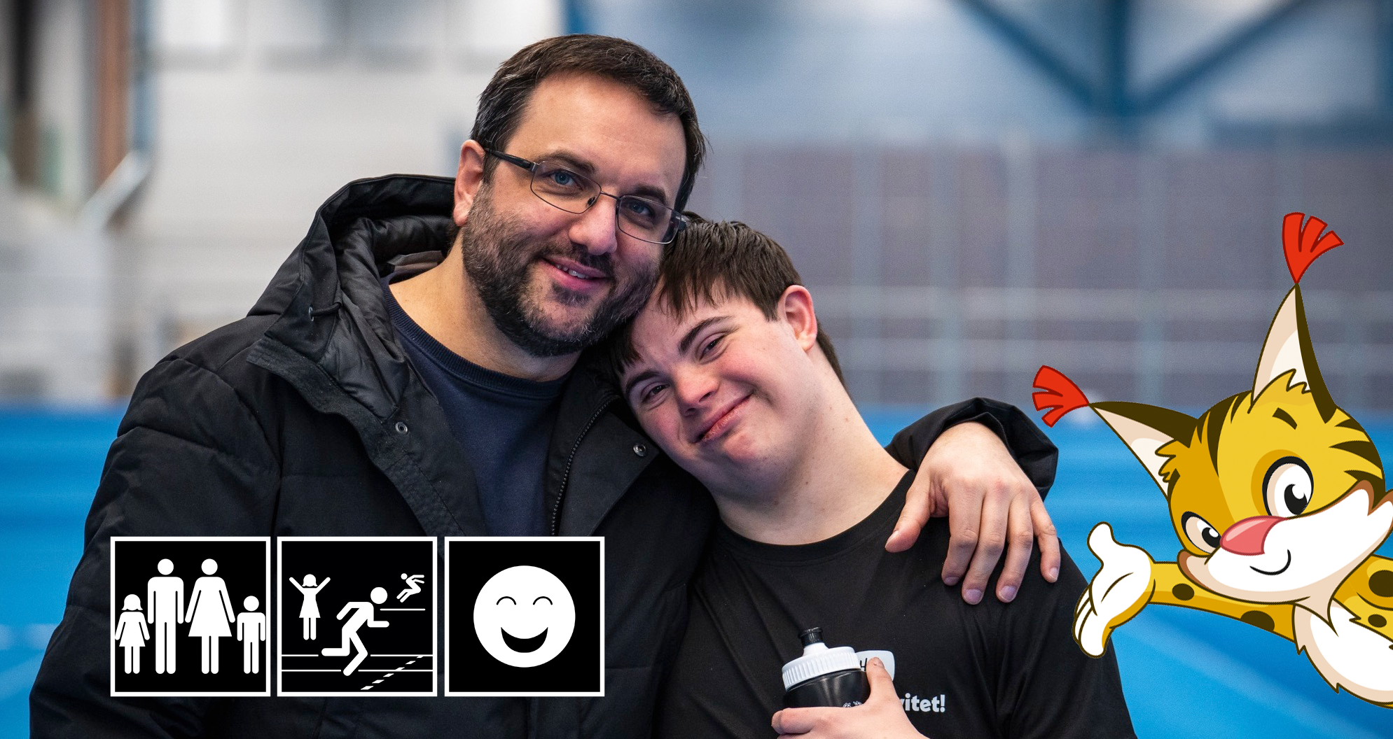 Två personer håller om varandra och ler. Till höger syns Special Olympics maskot Speci-Lo.