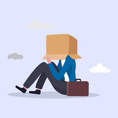 person sitting down box over head feeling ashamed with background