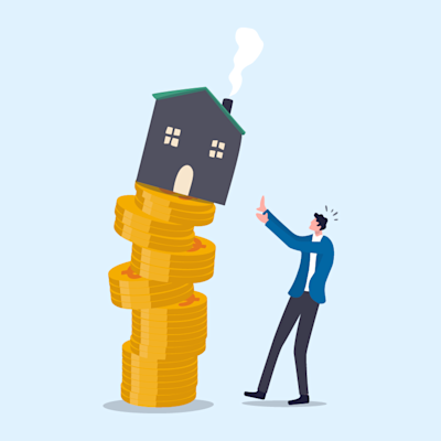 house on top of stacked coins falling over a man mortgage with background