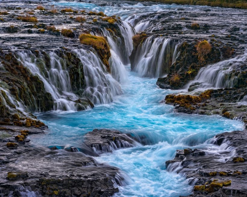 Brúarfoss makes our list of top iceland waterfalls due to its unique blue color.