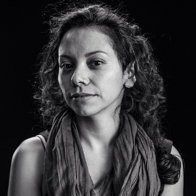 Jasmin Mara Lopez looks at the camera. Black and white portrait. 