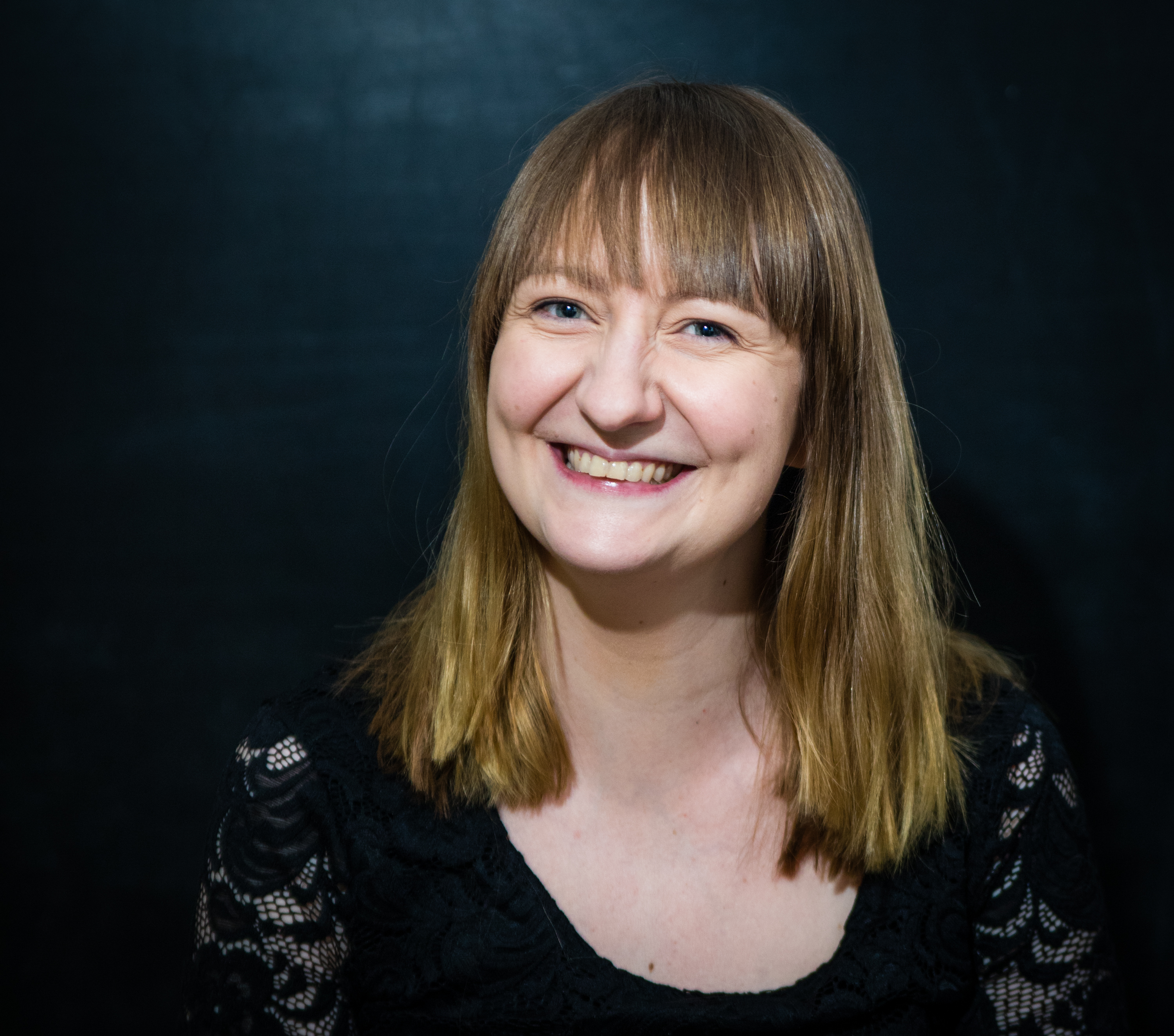 A photo of smiling caucasian woman.