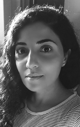 Sahar Yousefi looks directly at the camera. Black and white headshot.