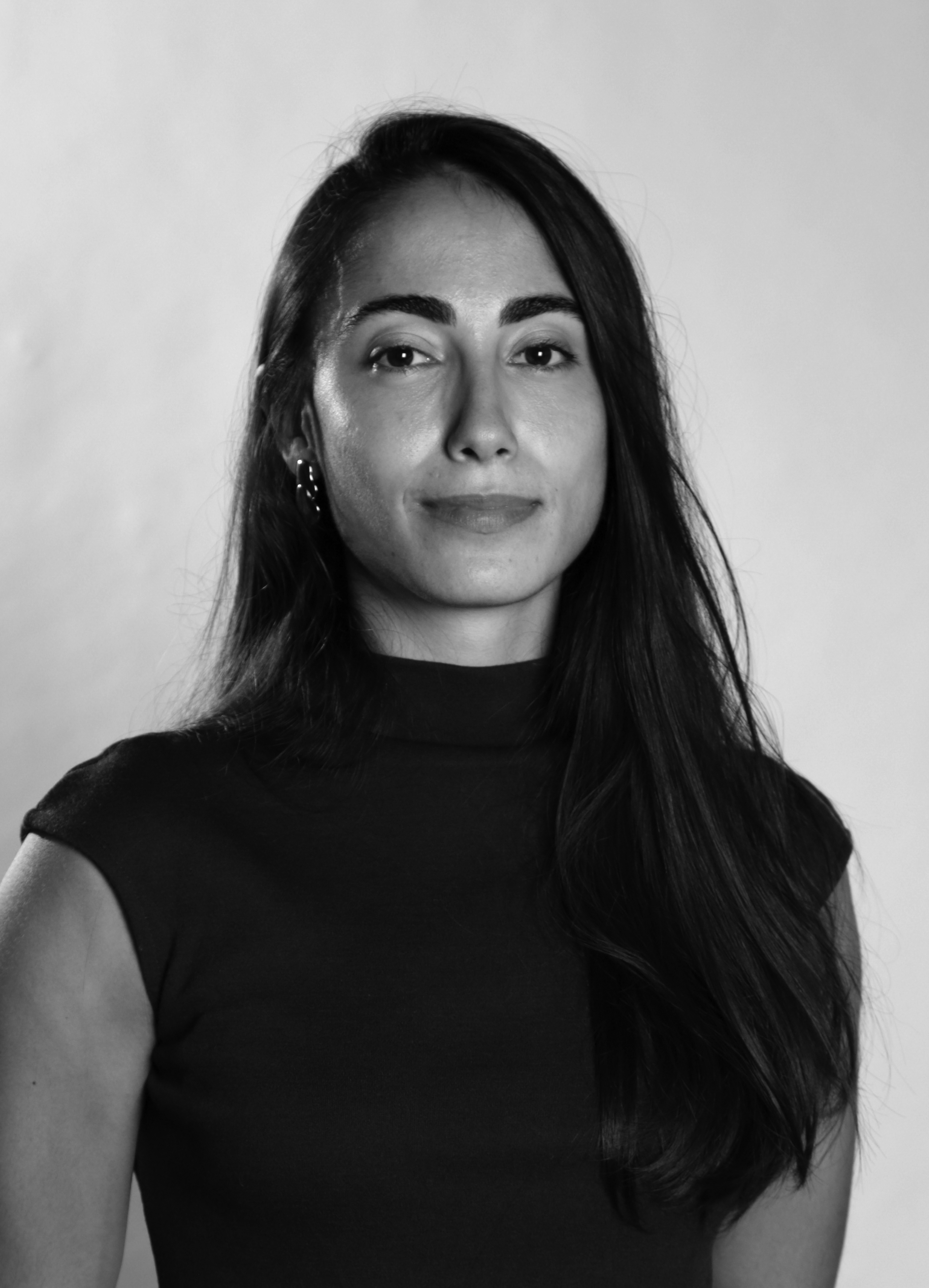 A black and white portrait of Cherine Karam.