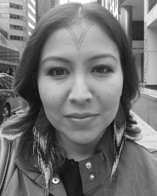 Alethea Arnaquq-Baril producer of Twice Colonized black and white headshot. An Inuit woman with shoulder length, dark hair and large beaded earrings looks directly at the camera. 