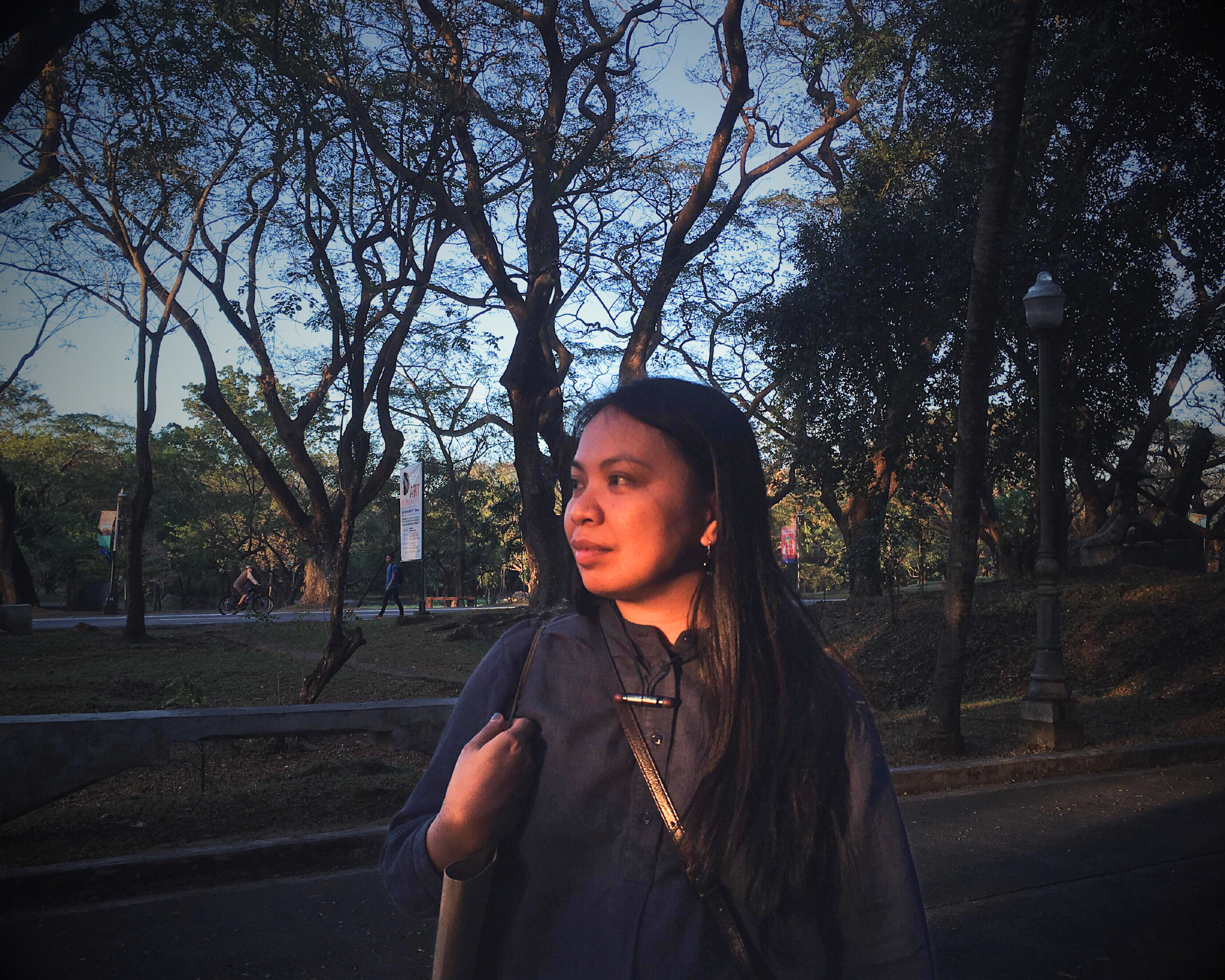 A photo of Jewel Maranan at a park at sunset.